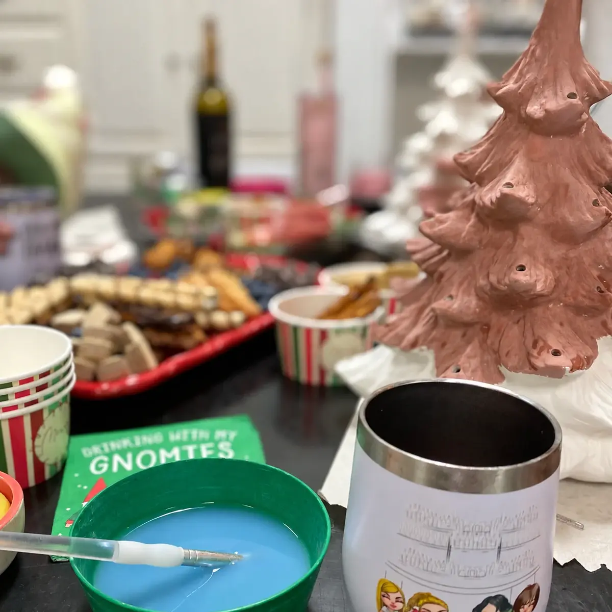 Vintage tree painting night at Joe Picasso’s, with a pink ceramic tree, snacks, a wine tumbler, and painting supplies
