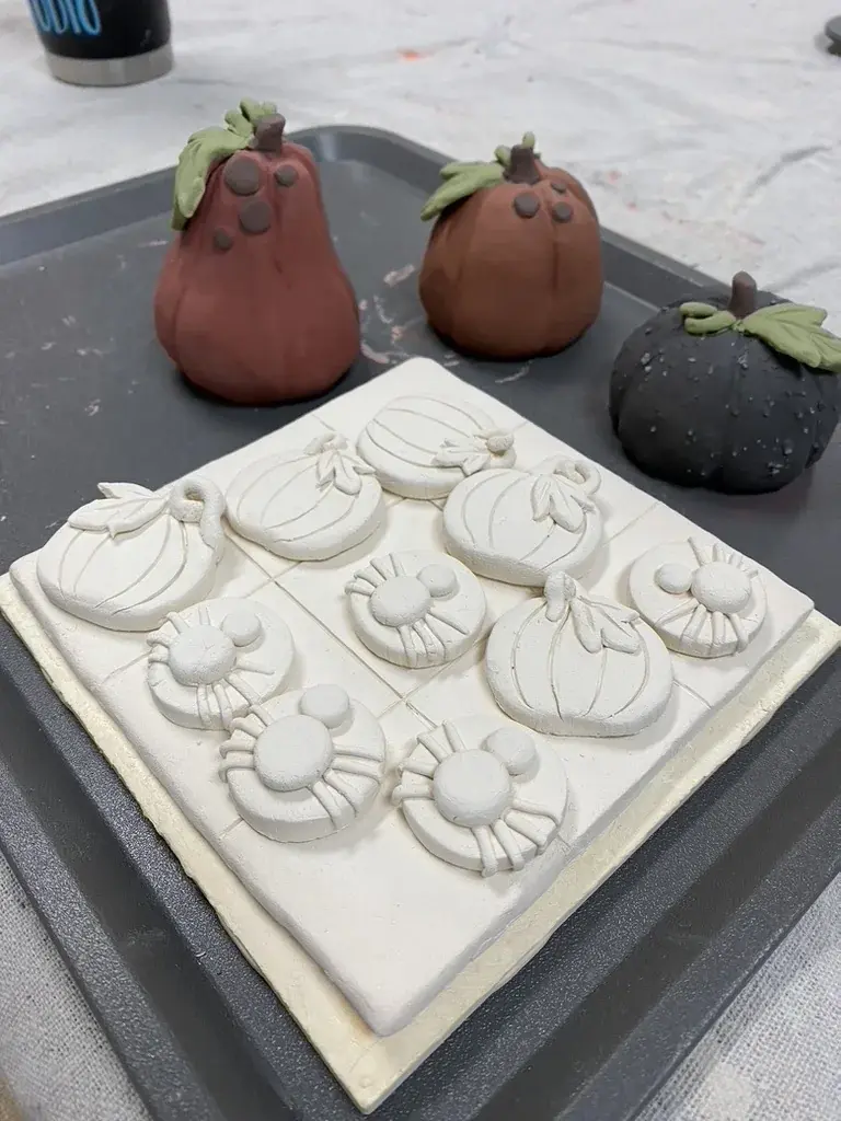 Glazed pottery piece on the pickup shelf